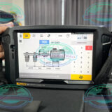 Technician aligning motor and pump with Fluke 831