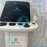 Lumenis NuEra Tight handpiece performing non-invasive abdominal skin tightening treatment