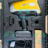 Olympus Vanta Max portable XRF analyzer performing alloy identification on stainless steel pipe
