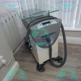 Zimmer Cryo 6 cooling device used during laser hair removal treatment.