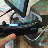 Practitioner performing facial skin tightening treatment using Bison Accento Dual Technology System.