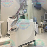 Physician performing facial pigmentation treatment using Bison Lucid Q-PTP laser technology.