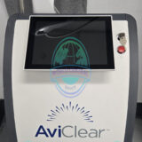 AviClear laser handpiece delivering acne treatment