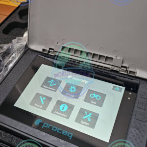 Technician using Proceq Equotip 550 for metal hardness testing in manufacturing facility