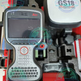 Leica GS18 T RTK Rover conducting GNSS land survey in open terrain