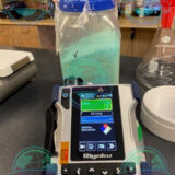 Law enforcement officer using Rigaku Progeny ResQ CQL Raman analyzer for narcotics detection