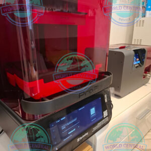 Dentist using SprintRay Pro 2 dental resin 3D printer in a modern clinic
