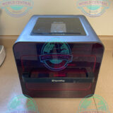 Dentist using SprintRay Pro 55S dental resin 3D printer in a modern clinic